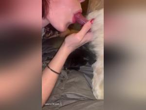 Amateur redhead woman in bestiality sex video with dog