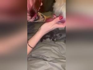 Bestiality video with a young woman and her dog