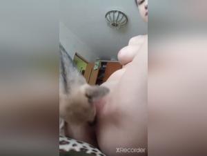 Woman with big breasts and dog