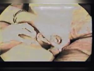 Vintage zoophilia video with a slut and a fish