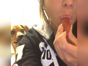 Woman daring the unimaginable with a dog