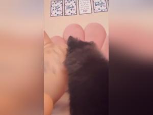 Curly-haired woman and her dog in bestiality video