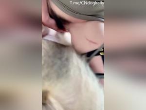 A woman fucks with a dog on a farm