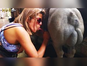 Woman with glasses and pig: a scene of extreme zoophilia