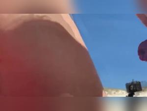 Shocking moments between a girl and her dog on the beach