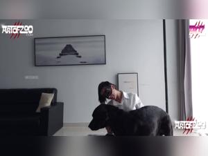 Raven and her canine companion in a beastly video