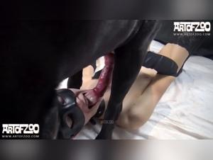 Submissive woman and her black dog: an intense bestiality session