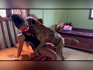 The brunette blows her dog Ebony